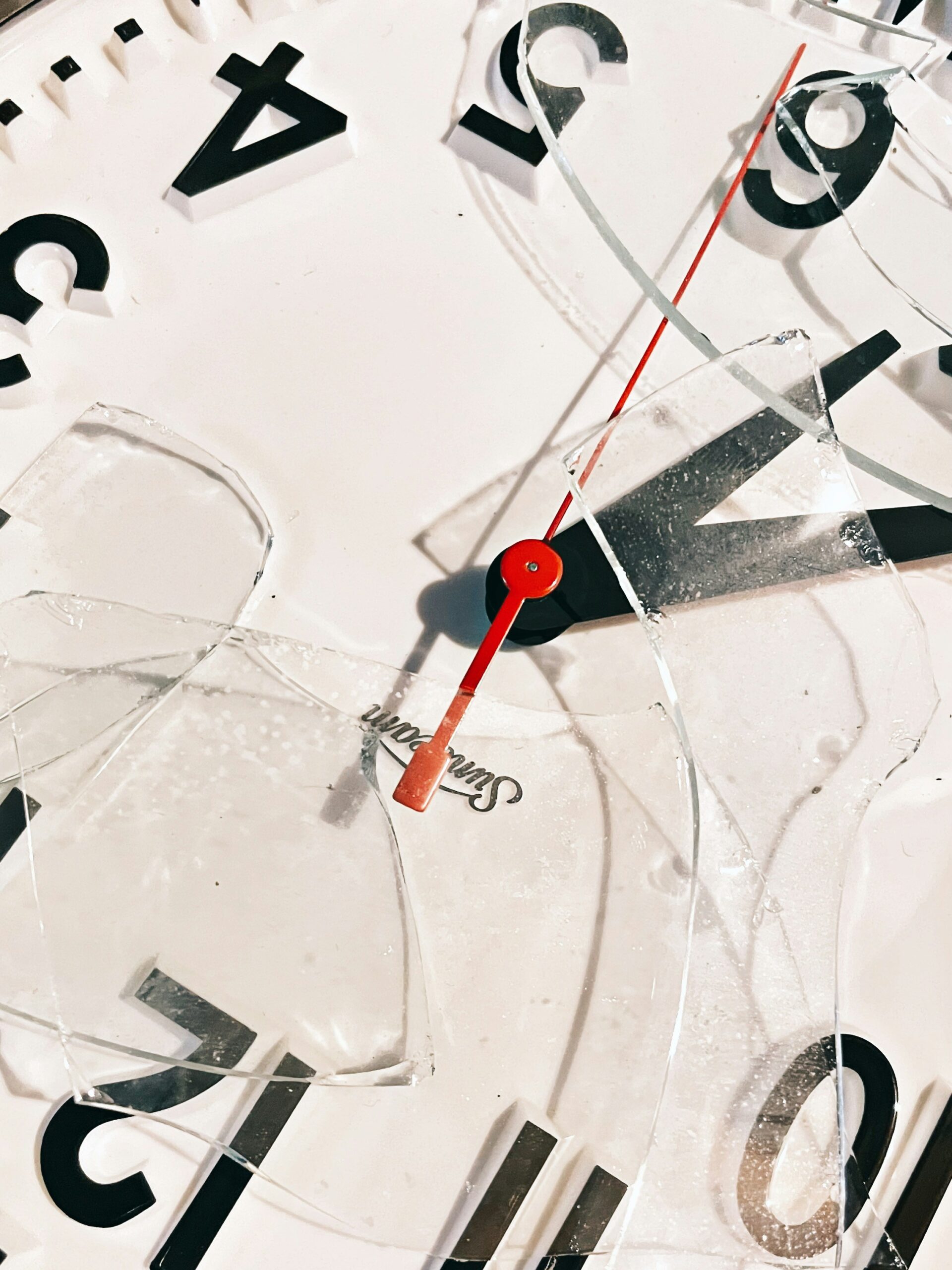 meghan-hessler-small-broken-clock An analog clock with the glass broken